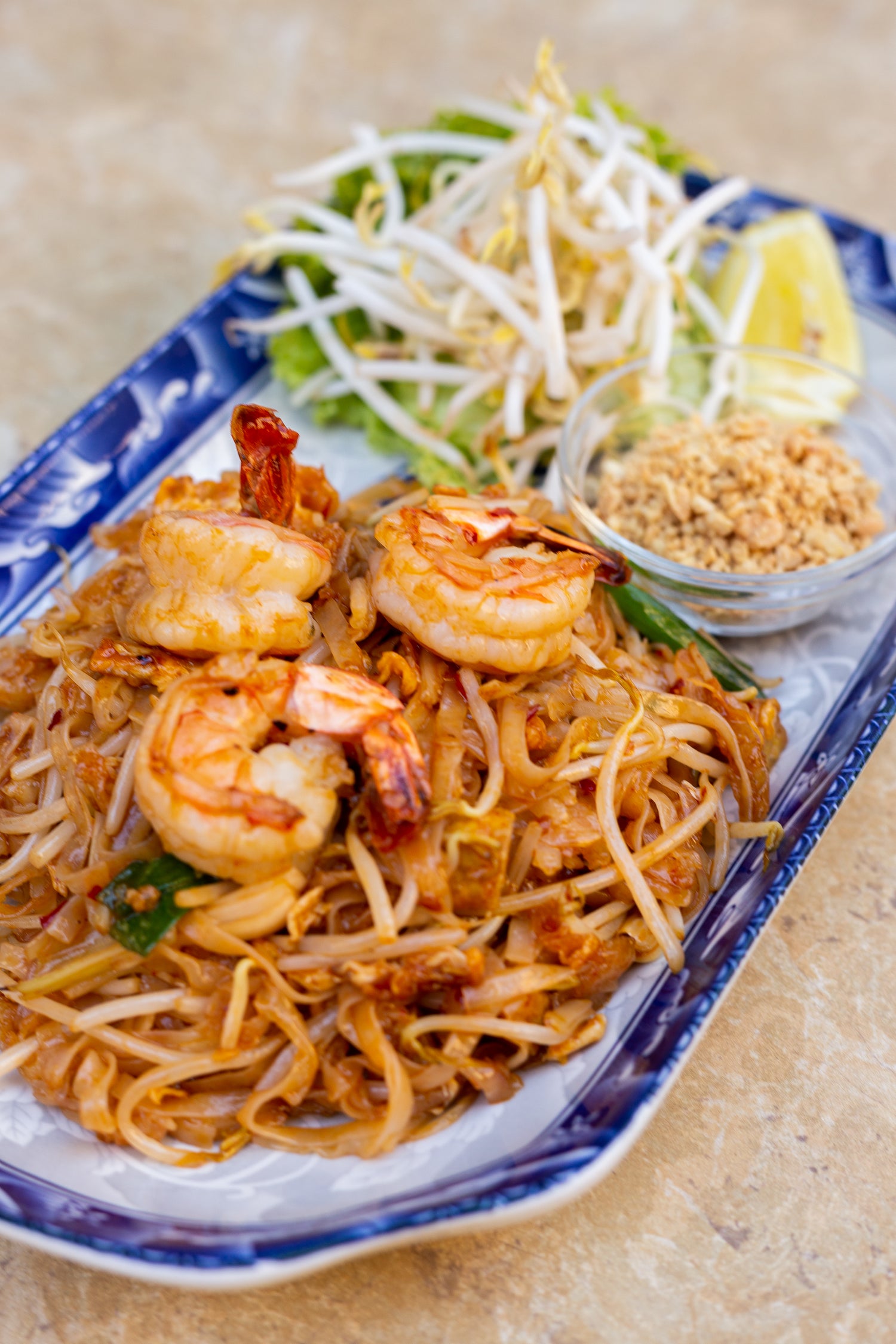 prawn pad thai noodles on table